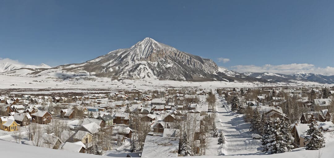 Crested Butte real estate - panoramic view of the town of Crested Butte in the winter.