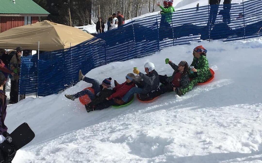 Photo of sled train from the 2019 Sleds n Kegs Event in Crested Butte, CO