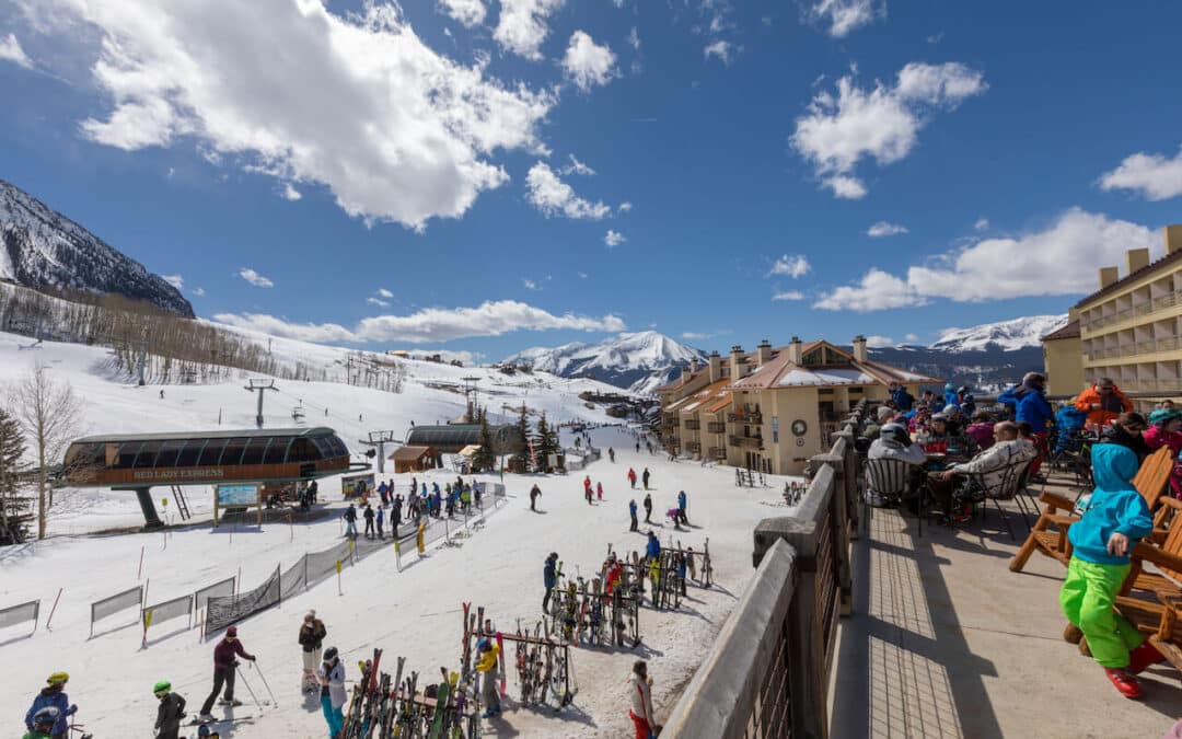 Crested Butte Real Estate - Spring skiing is here! Image overlooking the base area and Butte 66 deck.