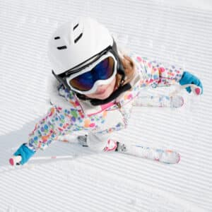 Crested Butte real estate - little girl skier looking up toward sky