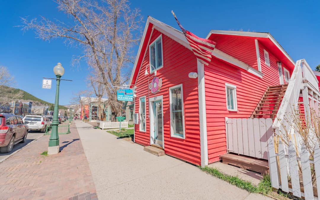 Crested Butte Real Estate - exterior view of 327 Elk Avenue, Crested Butte (MLS 793793). Red building with white trim.