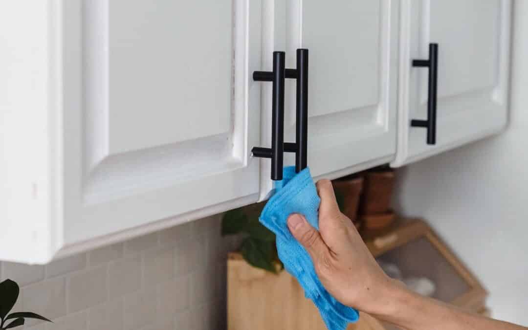 Crested Butte Real Estate Spring Cleaning Tips: wiping down kitchen cabinets