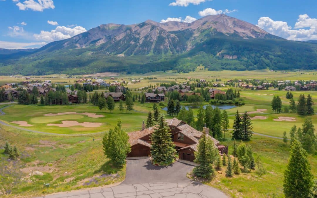 Crested Butte real estate - aerial view of 20 Par Lane, Unit 1, Crested Butte (MLS 797077). Whetstone Mountain and golf course in background.
