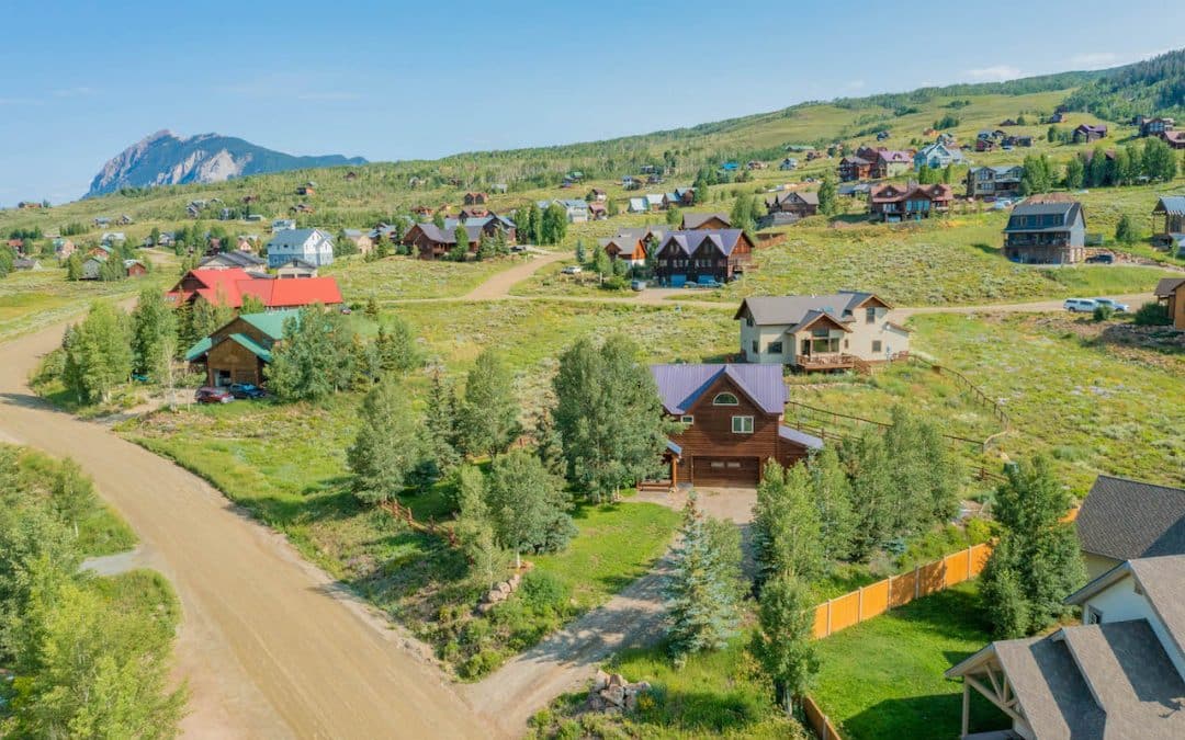 Crested Butte real estate agent Kiley Flint has 722 Cascadilla Street, Crested Butte (MLS 796847) under contract. This is an aerial view of the home with Mt. Crested Butte in the background.