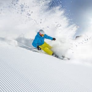 Crested Butte events - image of skier on groomed ski slope